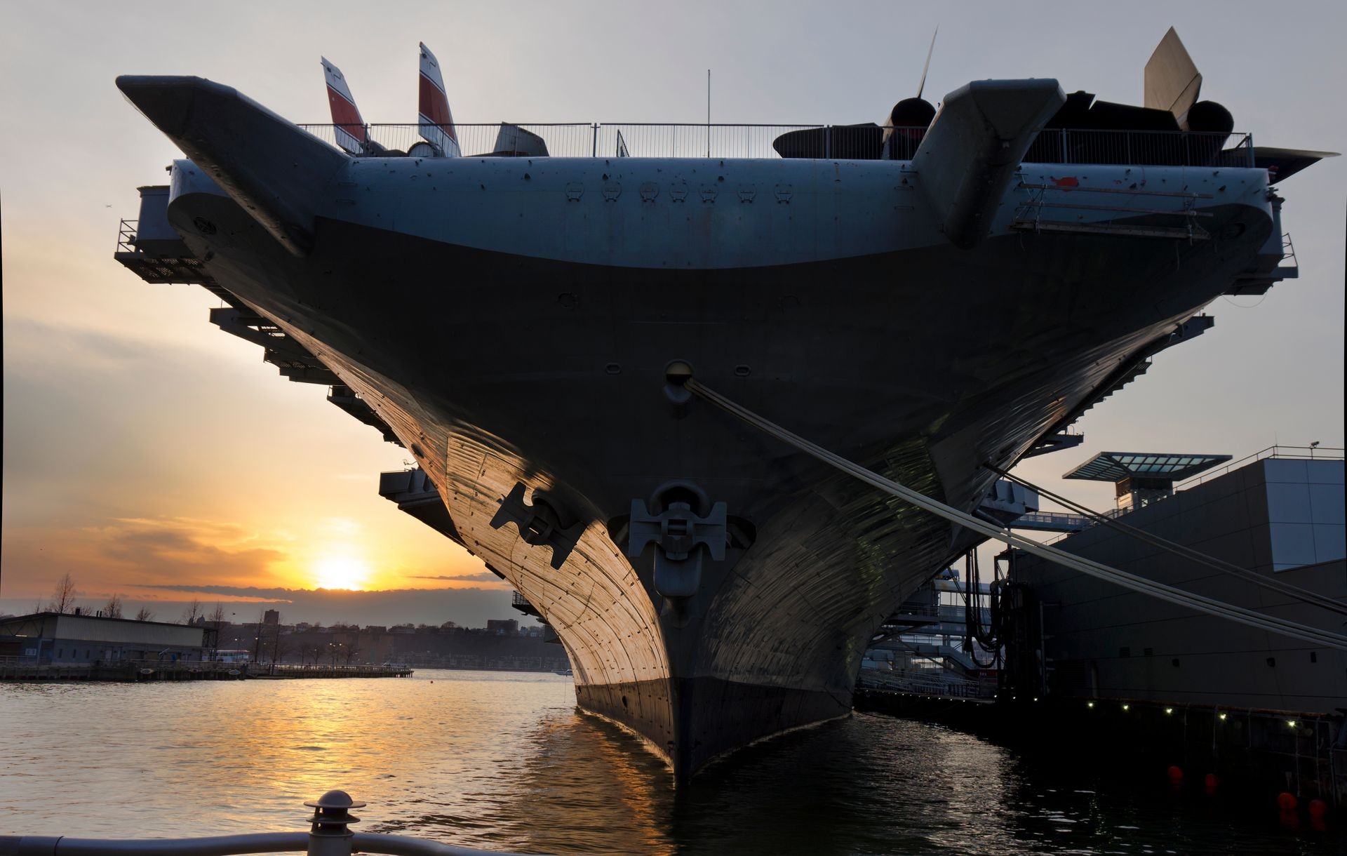 huge aircraft carrier in sunset